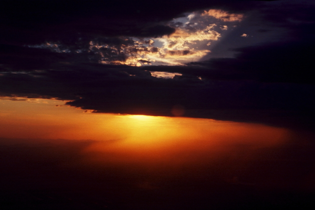 The setting Arizona sun as we navigated around a dying thunderstorm while flying back from Elsinore in Greg's Cessna 170 in July 1977.