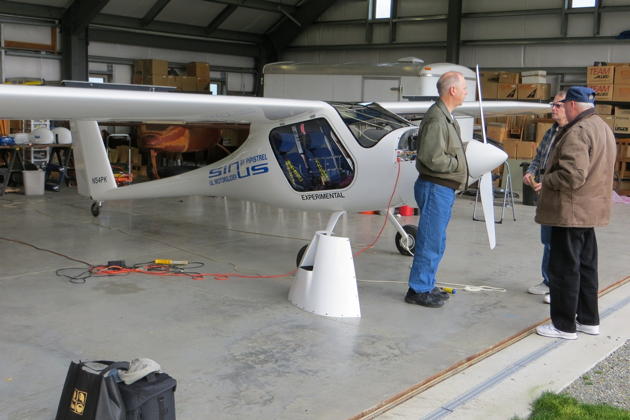 Pre-flighting Sinus N54PK with Paul Kuntz in his hangar at Sequim Valley airport. Photo by Jim Bettcher.