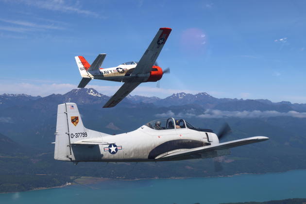 Scott Urban pitching out in his T-28B with T-28D Lumpy, flown by John 'Smokey' Johnson, over the Hood Canal. My photo.