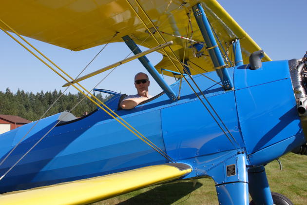 Trying not to drool in the cockpit of the Stearman PT-18. Photo by Rich Alldredge.