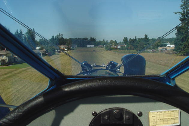 Flying a low approach in the Stearman over Cawley's South Prairie airport.