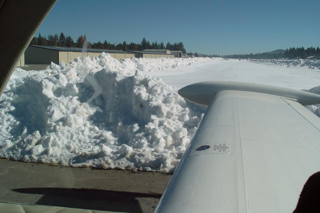 Snow piles along the taxiway at Big Bear City airport.