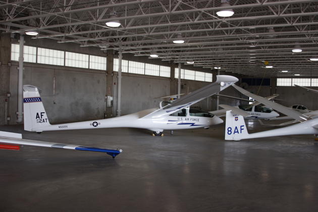 Multiple TG-16As and other USAFA sailplanes in the USAFA Soaring hangar.