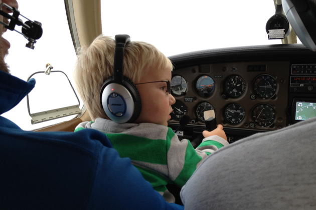 Alex at the controls during his first flight! Photo by Katie Kasprzyk.