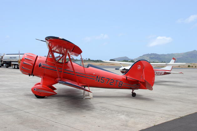 Kevin Britt's WACO 'Snoopy 2' at Lihue airport in Kauai, with 'Fly Kauai's Cessna 182 in the background.