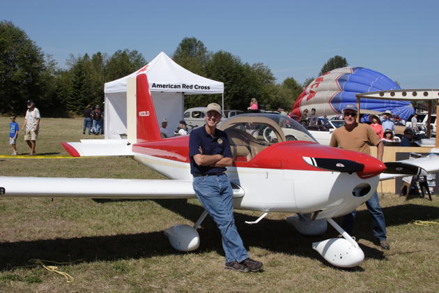 Dan Masys on the wing of his RV-12 at the Sequim Valley airport.
