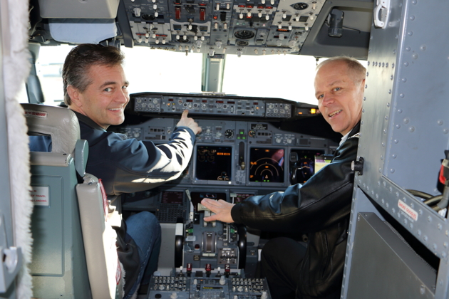 Mark Laville, my partner in our Warrior, checking out Ma's BBJ cockpit. Photo by Rebecca Polivy.