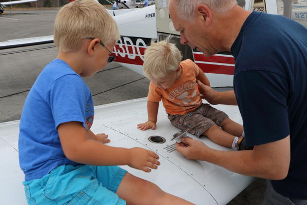 Alex and Nathaniel checking fuel level while pre-flighting the Warrior. Photo by Katie Kasprzyk.