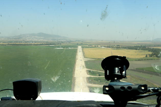 Landing back at Megiddo airfield's runway 09, with Mt Tabor in the distance. Yes, those bugs are large in Israel!