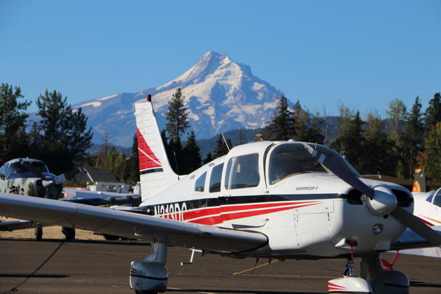 3DC at the Hood River Fly-in with Mt Hood in the distance, and Tom Burlace's Navion from Colorado in trail.