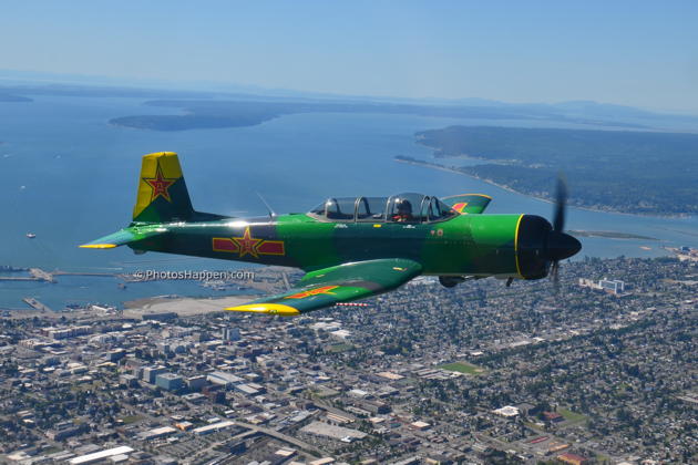 Larry 'Spooky' Pine in his Nanchang over Everett on the climbout to our formation working area. Photo by Karyn King.