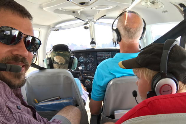 Alex in the pilot's seat, with David and Nathaniel, taxiing for takeoff at Fullerton, CA. Photo by David Kasprzyk.