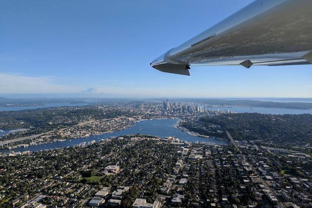 A view of Lake Union and downtown Seattle from the Icon A5 open window, with Mt. Rainier in the distance. Photo by Macaela Wright.