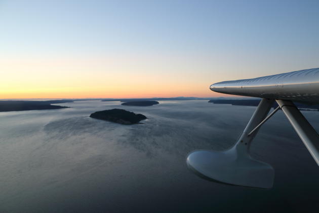 The Seabee in her element - in-flight over the waters of the Puget Sound near Hat Island just after sunset.