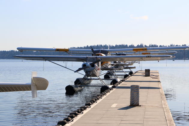 SuperCub N390CC leading an afternoon seaplane lineup on the dock at the Kenmore Air Harbor.