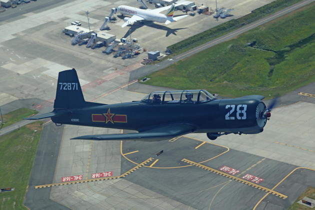 Joining up in close formation with the Nanchang over the departure end of Paine Field. Photo by Dan Shoemaker.
