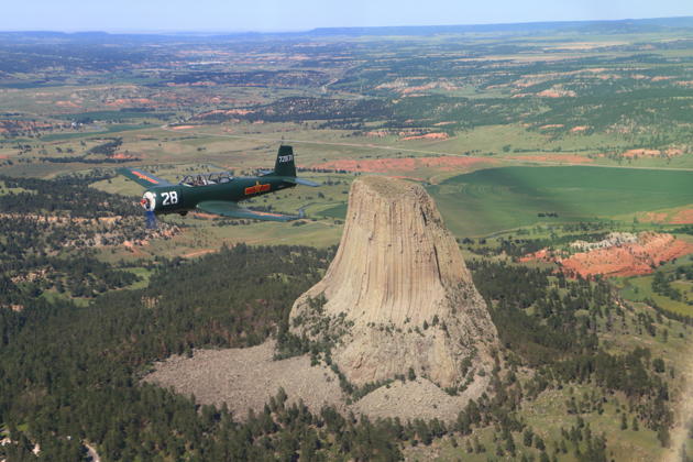 A gorgeous view of Justin Drafts in his Nanchang CJ-6 over Devil's Tower, WY.