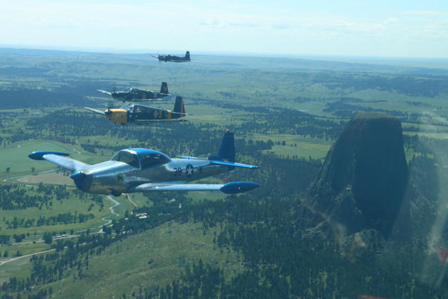 Cascade Warbirds passing by Devil's Tower en route to Oshkosh.