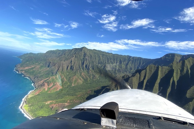 A view over the nose of our Cessna while cruising along the Na Pali coast.