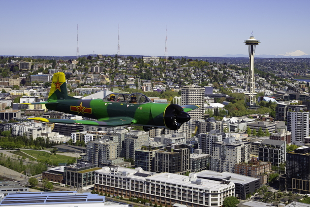 Larry Pine in his Nanchang CJ-6 over Seattle and the Space Needle. Photo by Dan Shoemaker.