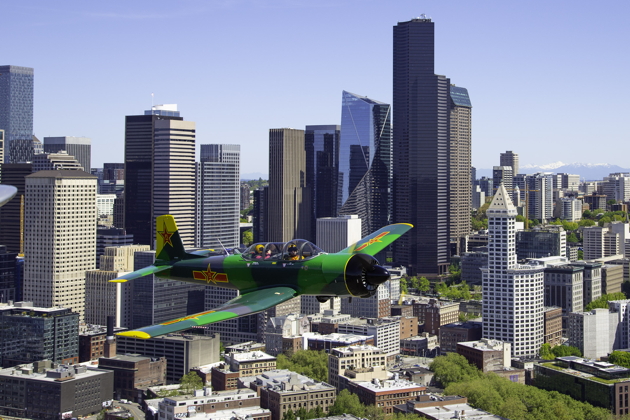 Larry Pine in his Nanchang CJ-6 over downtown Seattle. Photo by Dan Shoemaker.