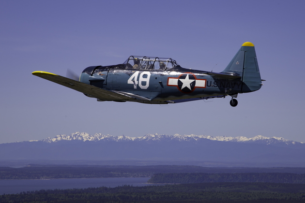 Smokey Johnson in the lead in his T-6 as the formation starts southbound over the Puget Sound. Photo by Dan Shoemaker.