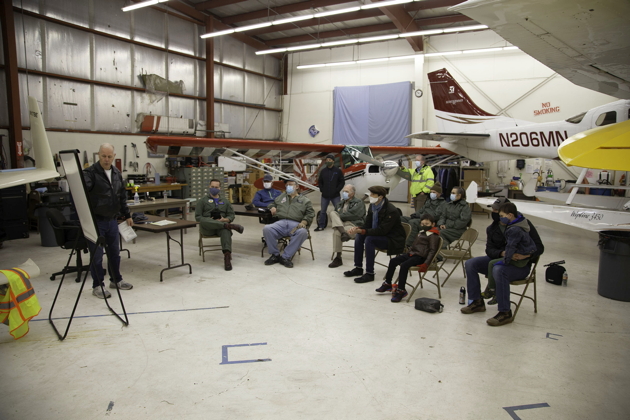 Briefing the team inside the Boeing Employees Flying Association hangar. Photo by Dan Shoemaker.