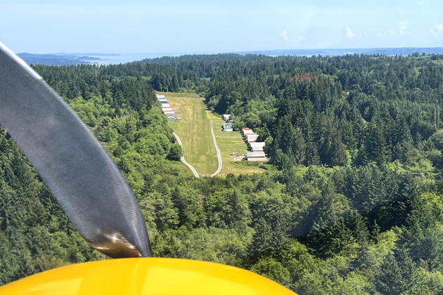 Flying a steep final in the Highlander over the trees at Vashon municipal airport to the 2001-foot runway 35.