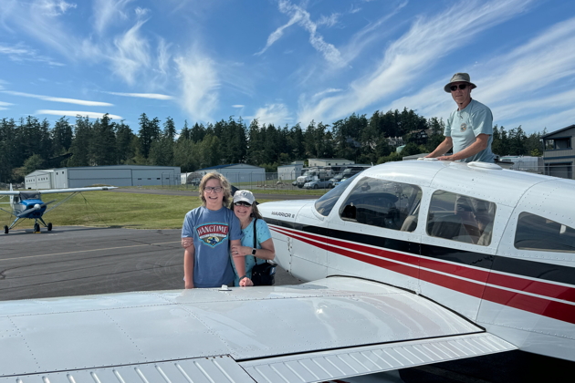 Ma hugging Alex after a great flight to Friday Harbor. Photo by David Kasprzyk.