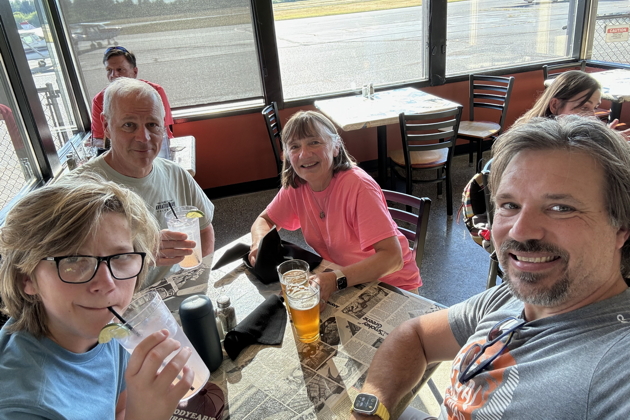 Enjoying lunch at the Hub after landing at the Tacoma Narrows airport. Photo by David Kasprzyk.