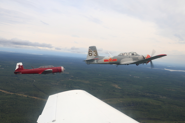 Chris 'GITFO' Walker and Brian 'GUMP' Youmans in their Nanchang CJ-6s. My photo.