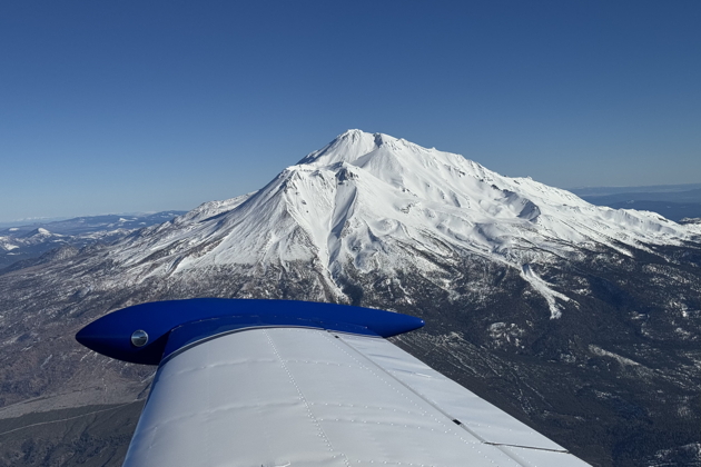 Mt. Shasta from overhead Weed, CA in the Comanche at 10,500 feet. My photo.