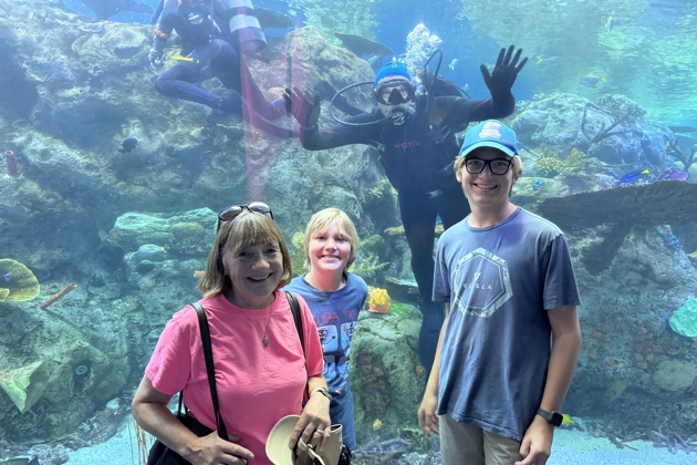 Ma, Nathaniel and Alex with David floating behind them at the Long Beach Aquarium of the Pacific. My photo.