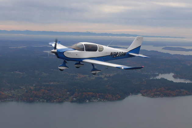 Chris Terrell on the wing in 8BW with Mt. St. Helens peaking out in the distance. Photo by Troy 'T-Lar' Larson.
