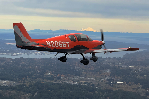 On the wing of 66T with Mt. Rainier in the distance. My photo.