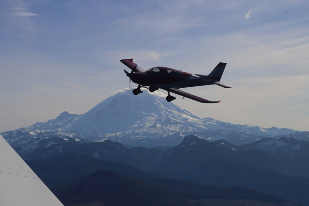 A nice backlit view of Brian Malcolm's Sling TSi in front of Mt. Rainier. Photo by Steve Cameron.