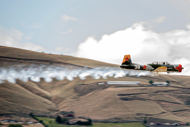 Jeff 'Spank' Hanoff's Nanchang CJ-6 N431DM 'Red Raider' smokin' by the Yakima Aviation Day, the weekend after Richland 26. Photo by Adrian Oliva.