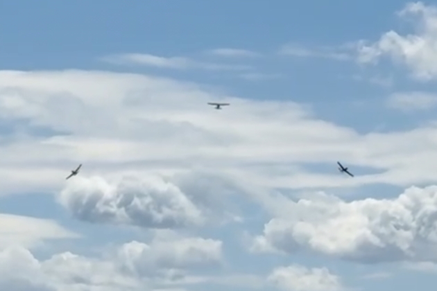 In the break for the 5th Fighter memorial flyby, Root Moser in the center, Lebeau Nicholson on right wing (left side of photo), and Sundance on the left wing (right side of photo).
