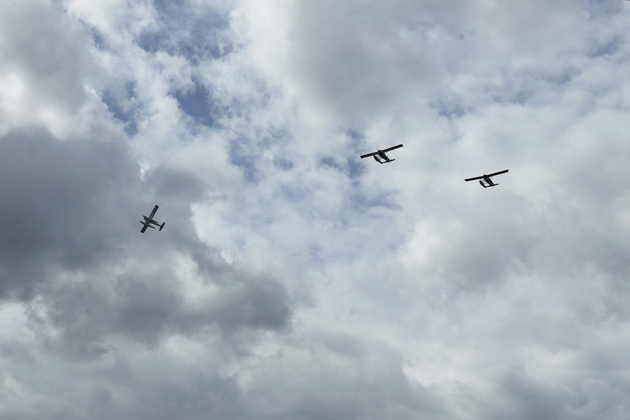 Beaver #3 departing west in the Beaver 'Missing Man' memorial formation.