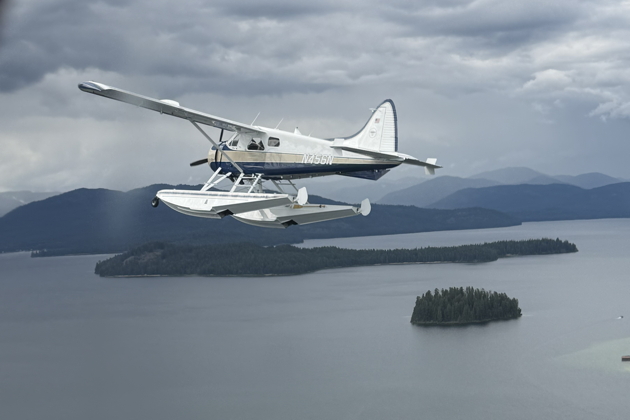 On the wing of Steve Ratzlaff's Beaver #1 after #3 departed west. Photo by Mary Kasprzyk.